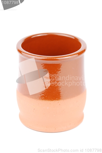 Image of Vibrant orange ceramic planting pot on white