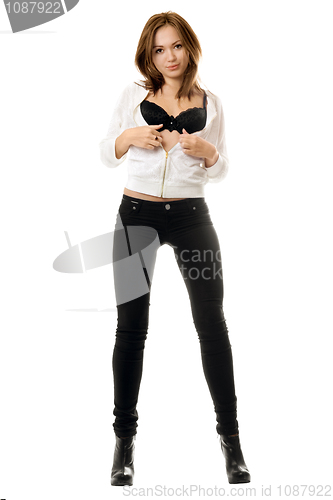 Image of Sexy young woman in black tight jeans