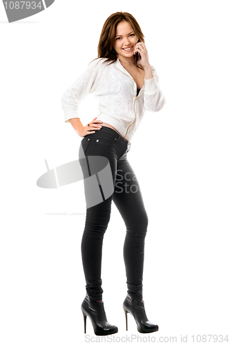 Image of Smiling playful woman talking on the phone