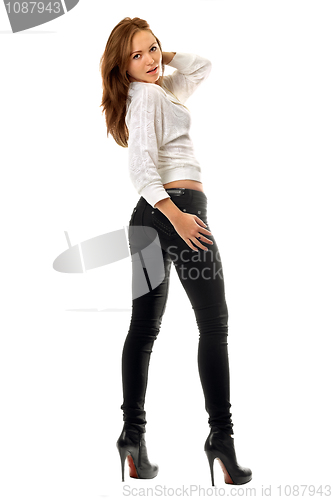 Image of Beautiful girl in black tight jeans