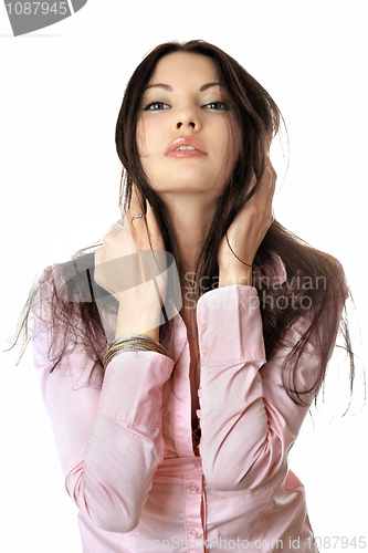 Image of Portrait of pretty young woman in pink shirt