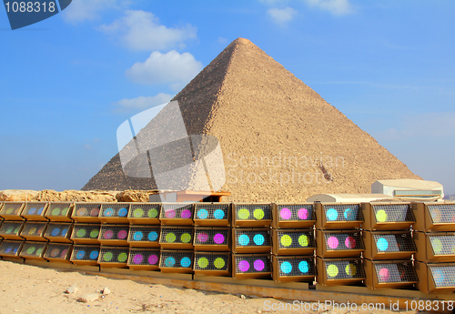 Image of egypt pyramid and colorful spotlights