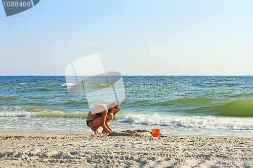 Image of Teenage girl on an empty beach
