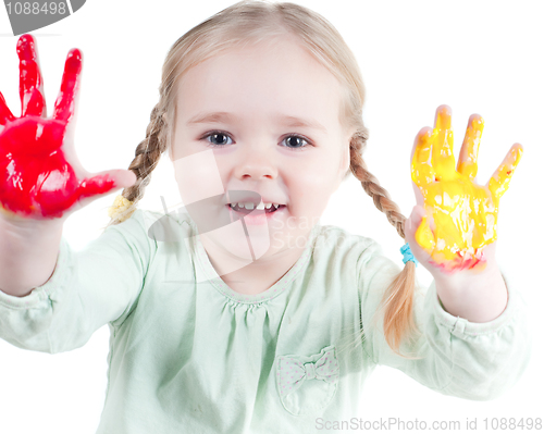 Image of Little girl playing with colors