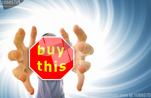 Image of Man grabing a red sign.