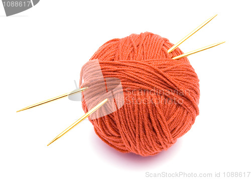 Image of Red ball of wool and knitting needles
