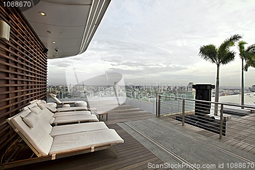Image of Lounging by Rooftop Infinity Swimming Pool