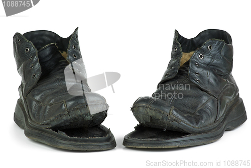 Image of Pair of torn old boots