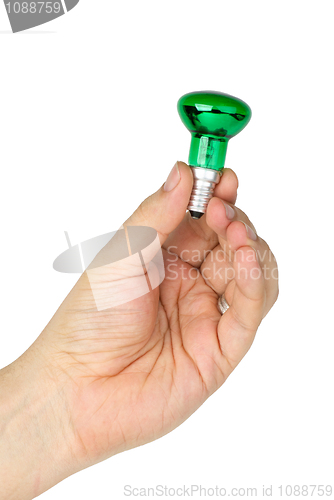 Image of Hand hold tiny green spot tungsten lightbulb