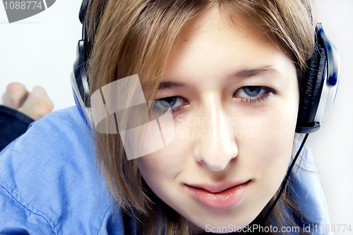 Image of Young girl in headphones   