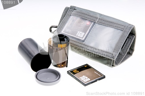 Image of Negative and digital film. Storage canister and card wallet with card.