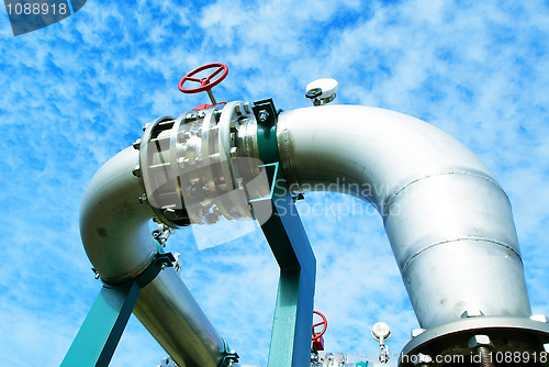 Image of Industrial zone, Steel pipelines and valves against blue sky