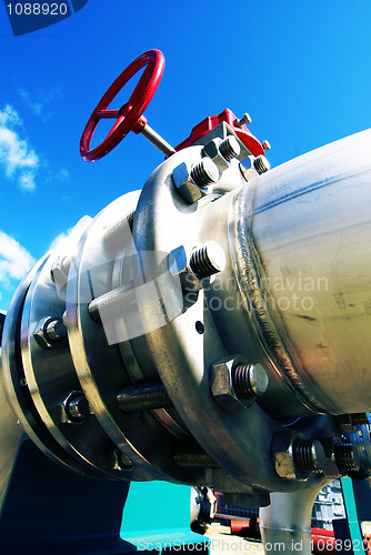 Image of Industrial zone, Steel pipelines and valves against blue sky