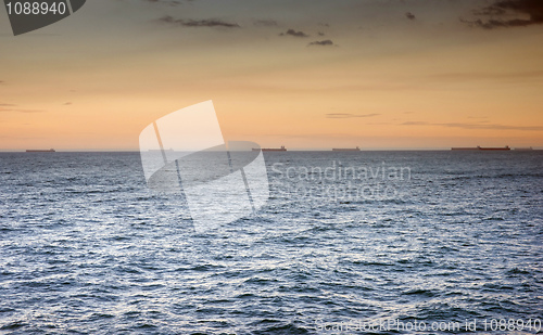 Image of ocean waves at sunset