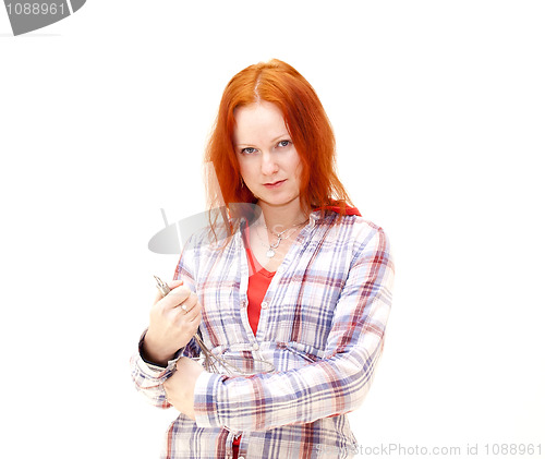 Image of redhead young woman cooks dinner