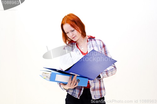 Image of Redhead young woman with a folder