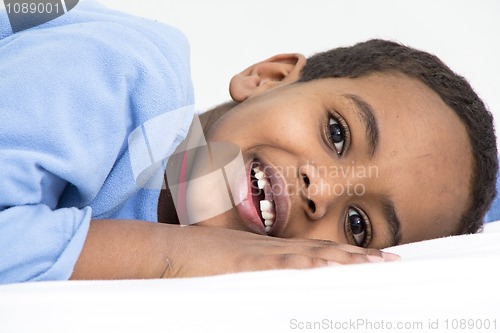 Image of Boy resting in his bed
