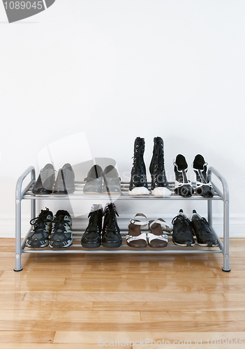 Image of Shoe rack on a wooden floor