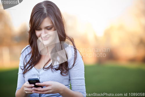 Image of Woman texting