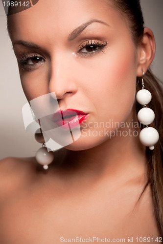 Image of attractive girl with white earring