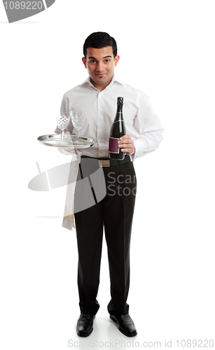 Image of Smiling waiter or servant with wine and glasses