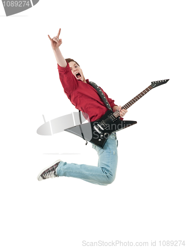 Image of Rock star with a guitar jumping