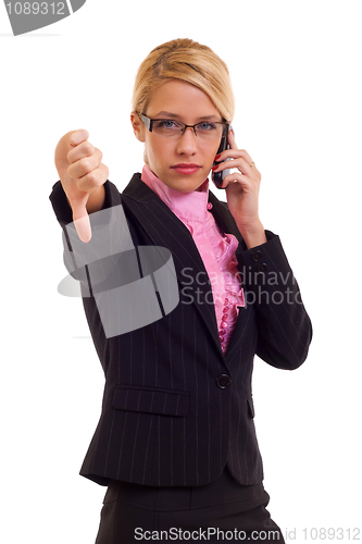 Image of Business woman gesturing thumbs down