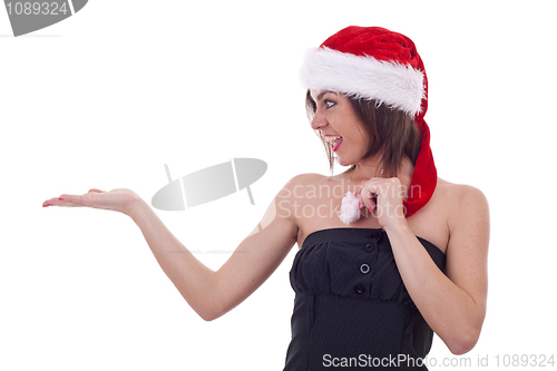 Image of woman in Santa Cap holding something 