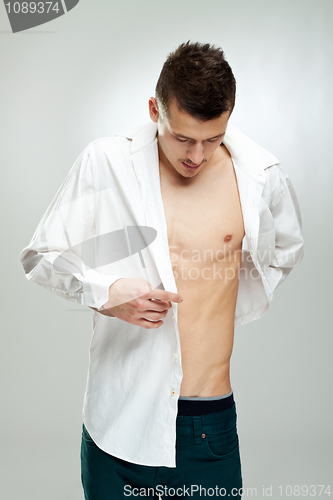 Image of  young man shows beautiful body