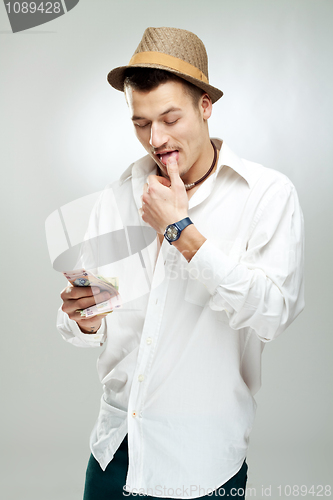 Image of young Man Counting Money