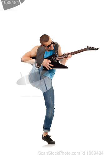 Image of kicking guitarist 