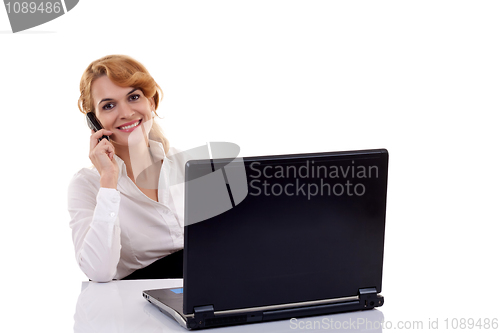 Image of woman working at her desk