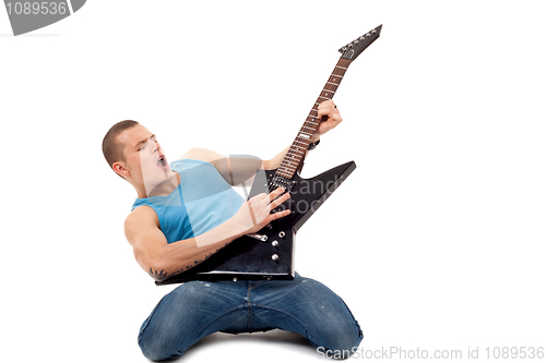 Image of man playing a guitar