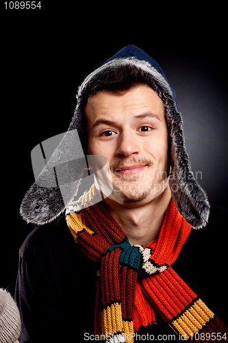 Image of young man wearing winter clothes