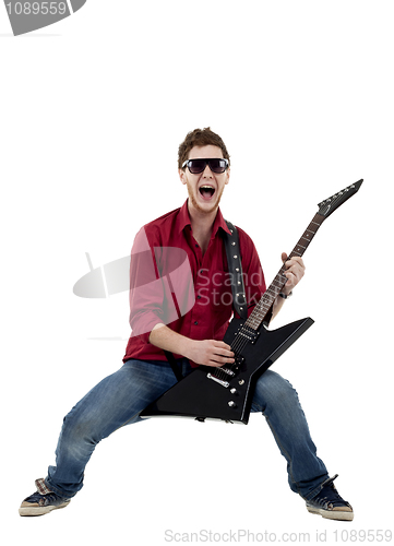 Image of Musician with guitar singing