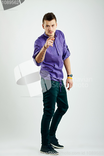 Image of fashion young man pointing