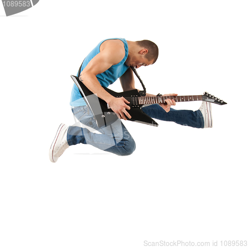 Image of guitarist jumps in the air