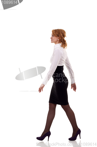 Image of  business woman is walking