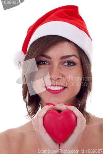 Image of holding red small heart in hands