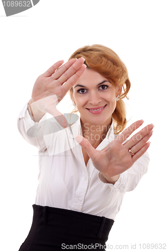 Image of  woman looks through a hand frame 