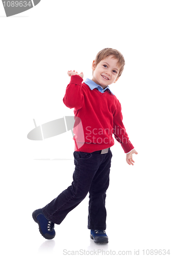 Image of smiling little boy in jeans