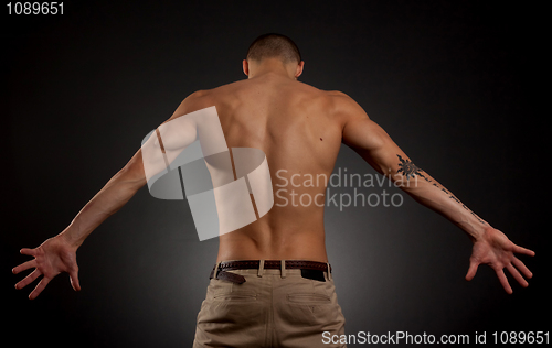 Image of young male on a dark background