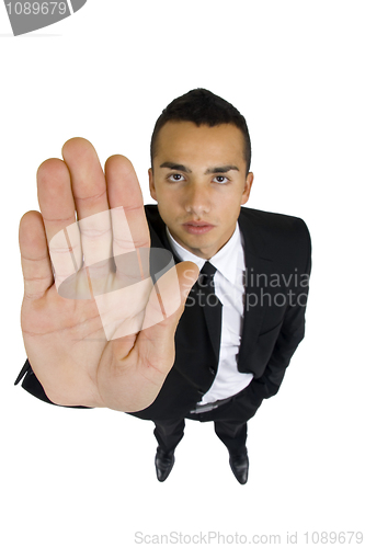 Image of Business man gesturing stop wide angle