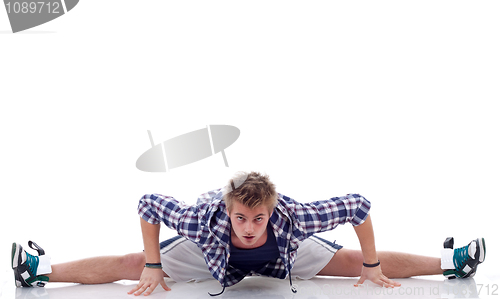 Image of dancer posing with legs streched