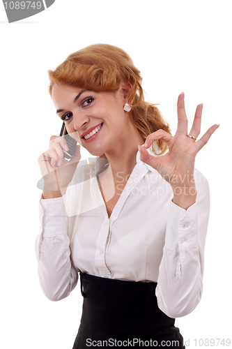 Image of  woman with phone and ok gesture