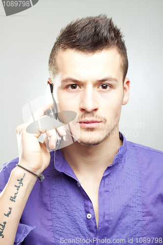 Image of man talking on cell phone