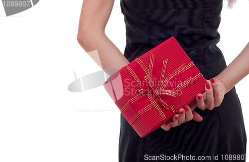 Image of woman holding a present on her back 