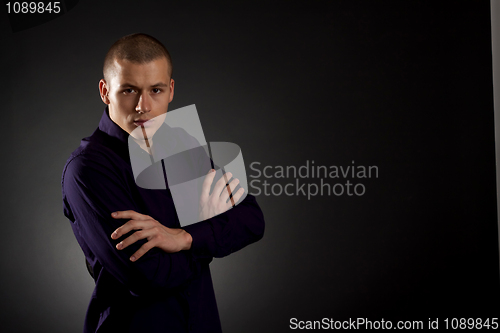 Image of young man on a dark background