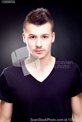 Image of young male model posing