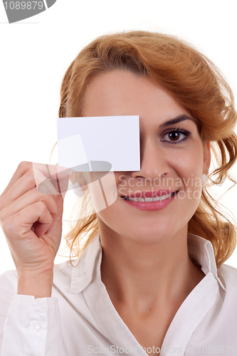 Image of woman holding blank card over her eye 